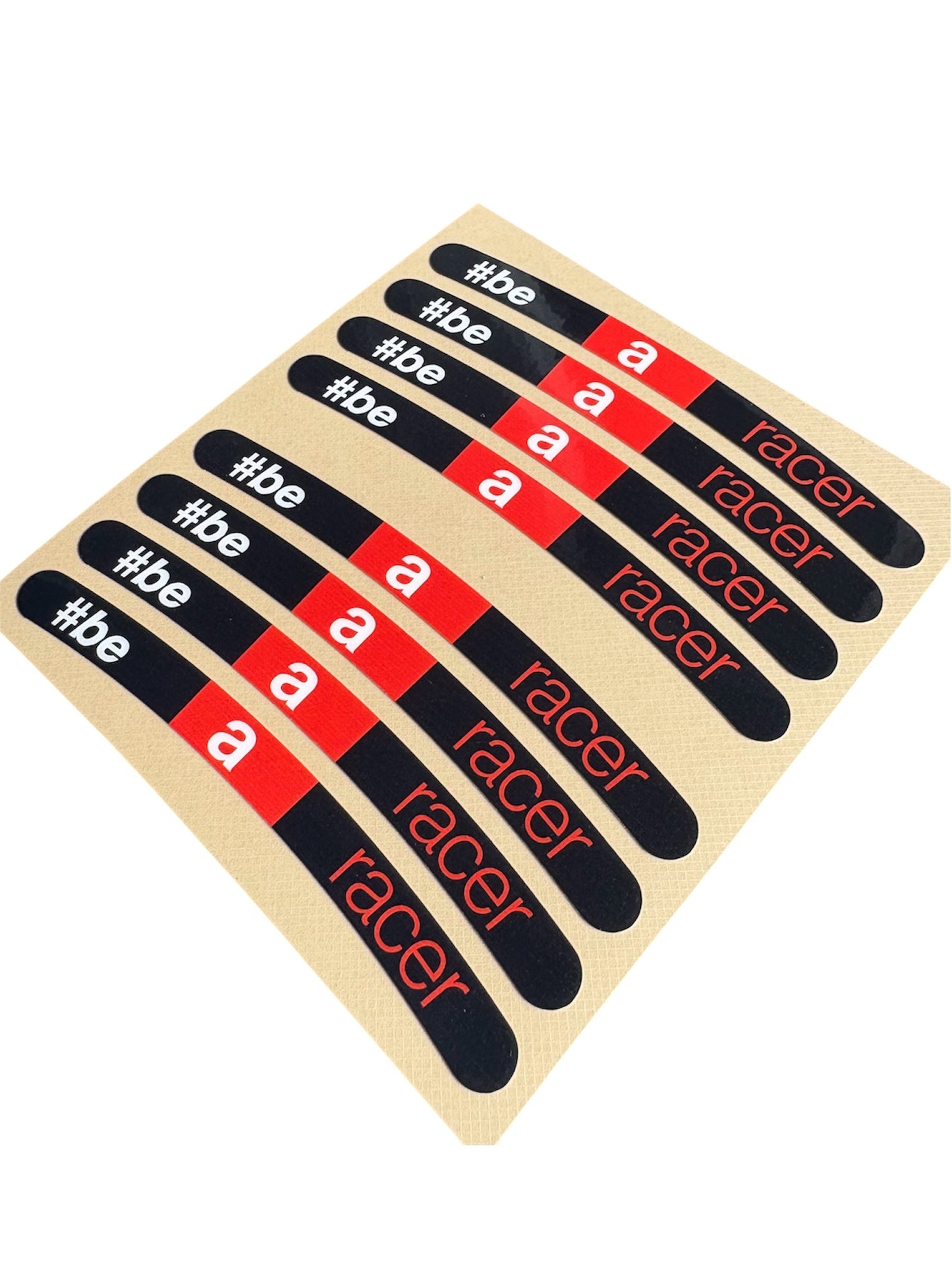 Set of 'be a racer' stickers on a wooden board