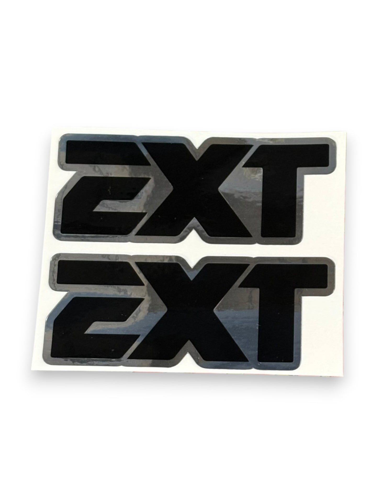 Two black 'EXT' vinyl decals with gray borders on a white backing sheet, shown against a plain white background.