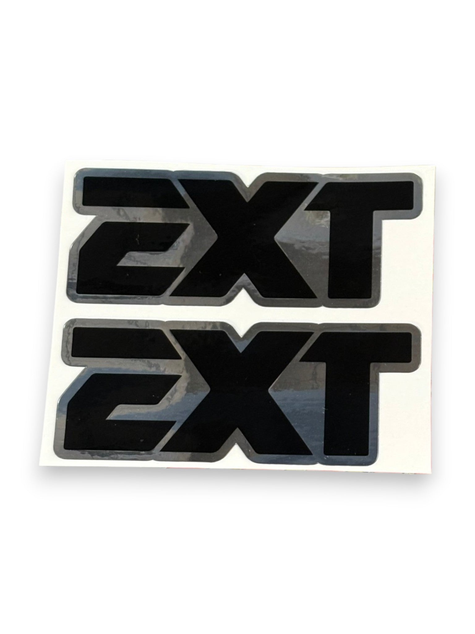 Two black 'EXT' vinyl decals with gray borders on a white backing sheet, shown against a plain white background.